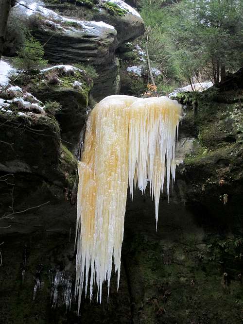 Beautiful orange-colored icicle in the Kirnitzschtal valley - close-up