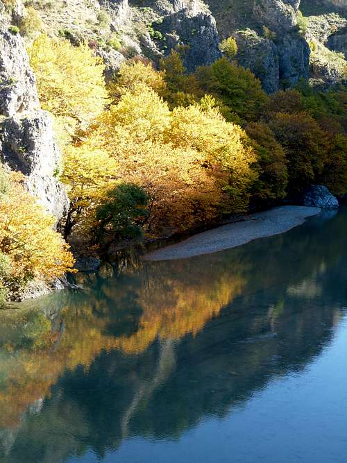 Autumn colors  and reflections at Aoos river 