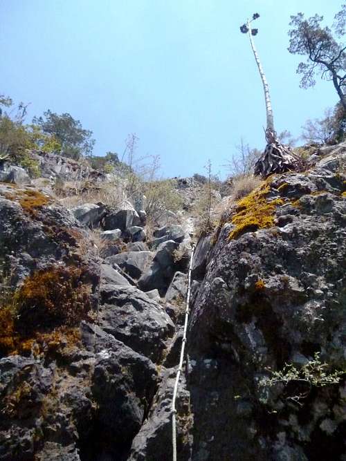 Rope attached to the rocks at the start of the climb up to the summit. 