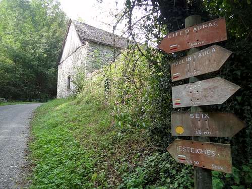Hiking signs and barn