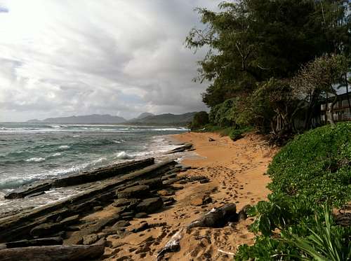 View of the coast of Kauai with its rugged mountains in the distance
