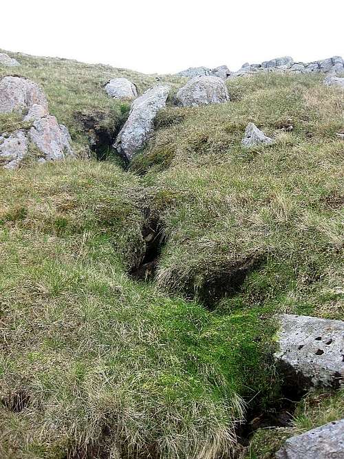 The diffuse source of Grains Gill at the edge of the Allan Crags summit plateau