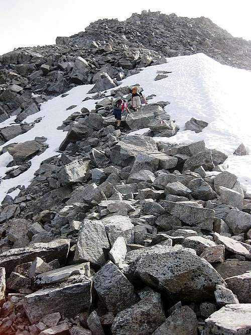 Scrambling up boulders on the Hohe Geige west ridge