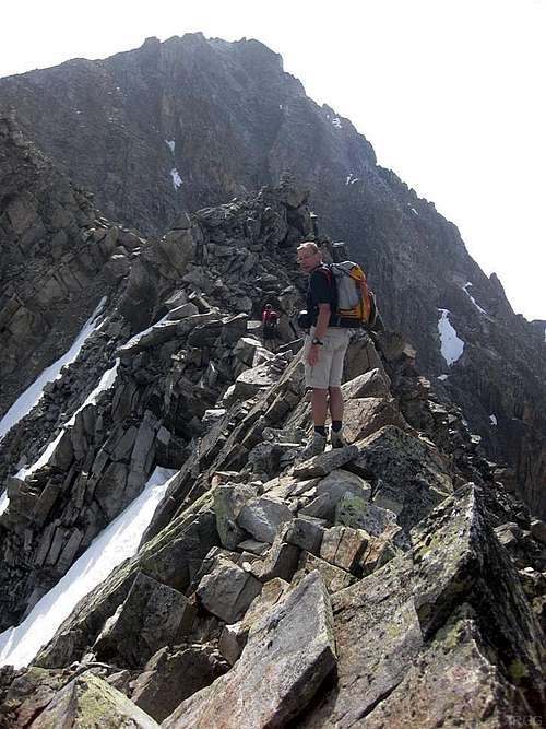 Crossing an exposed section on the Hohe Geige west ridge