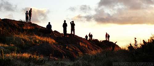 Hikers watching the sunset