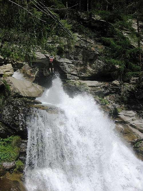 Crossing the falls on the Stuibenfall Via Ferrata