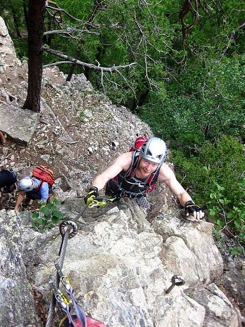 A happy climber on the Lehner Wasserfall Via Ferrata