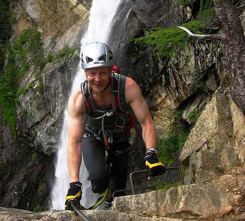 A happy climber topping out on the Lehner Wasserfall Via Ferrata