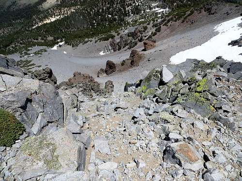 View down the a steep scree slope on the northeast side of the north summit