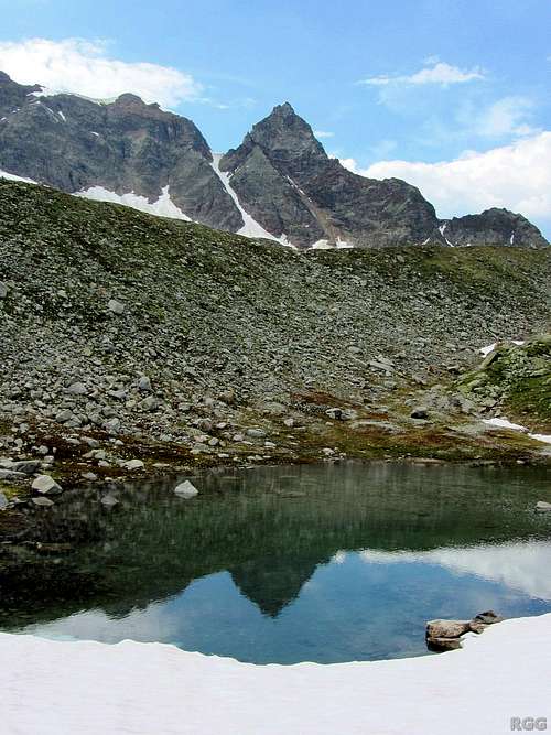 A melt water lake high in the Ochsental, mirroring the Schattenspitze (3202m)