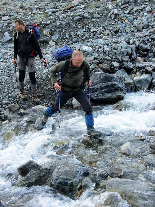 Wilco and Paul are crossing a little mountain stream just below the Vermunt Glacier
