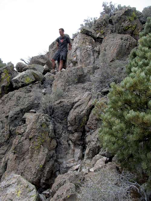 Greg ascending summit rocks