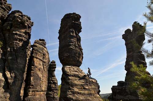 Climbers on the sandstone rocks in Bielatal