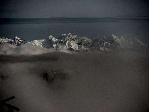 Mountains coming out through the clouds