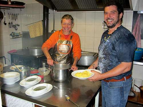 Marina and Enrico preparing dinner at Rifugio Pietro Crosta