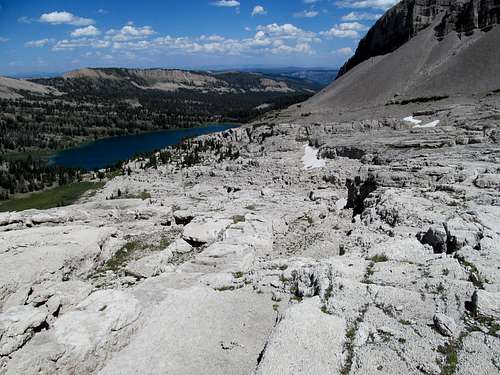 view of ledgy terrain down to Brewster Lake