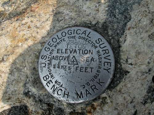USGS summit marker at the top of the Grand Teton