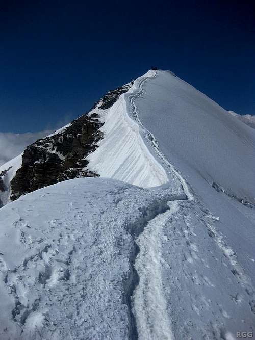 View up the SE ridge to the summit of Castor