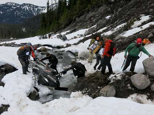 Snow bridge collapse under snowmobiler