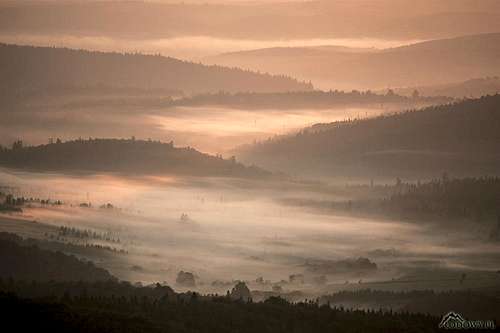 Upper San valley in sunrise mist