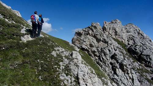 Hikers on the Günther Messner Steig, approaching the last exposed part