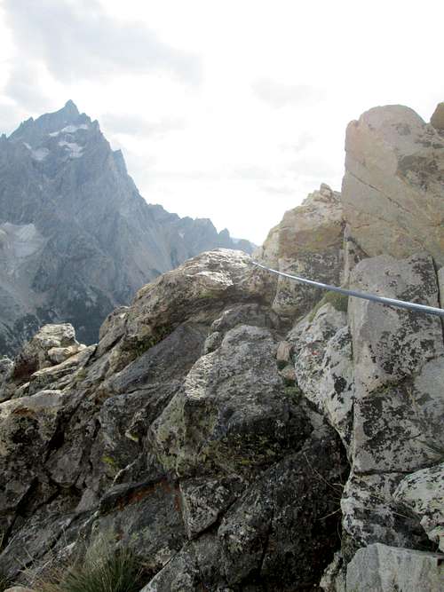 The rope trailing down the mountain from the belay at the base of pitch 4, Southwest Ridge of Symmetry Spire, Teton Range, WY