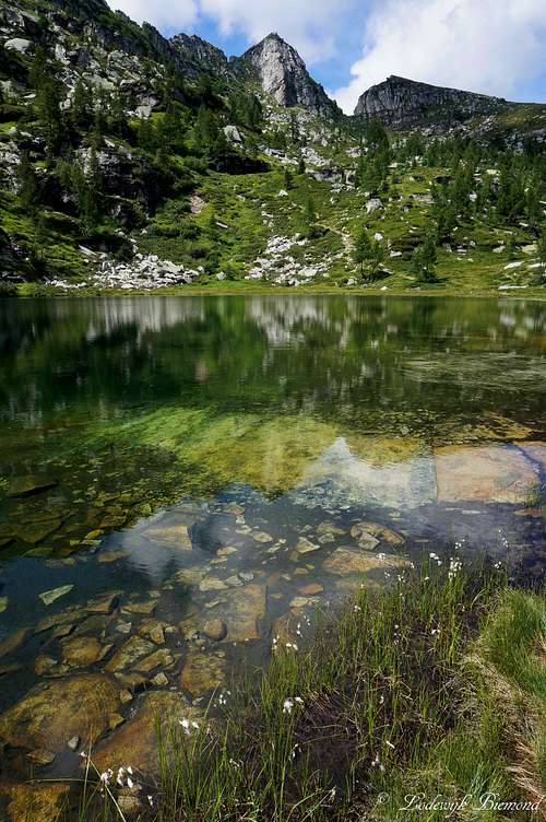 Clear water in front of Cima del Masnee