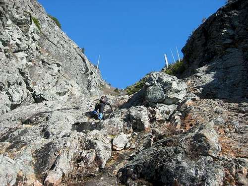 hikeing up the steep rock gully