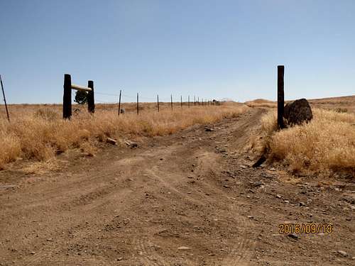 South-bound fence and road near Pyrenees sign