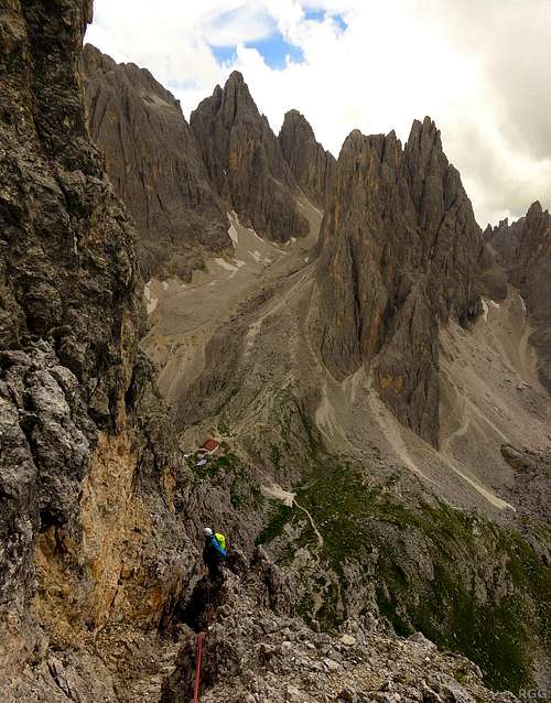 High on Torre Wundt, with the high spires of the Cadini Group in the background