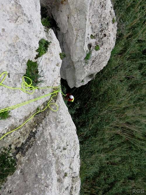 Jan rappels to the base of the Munxar Valley crags