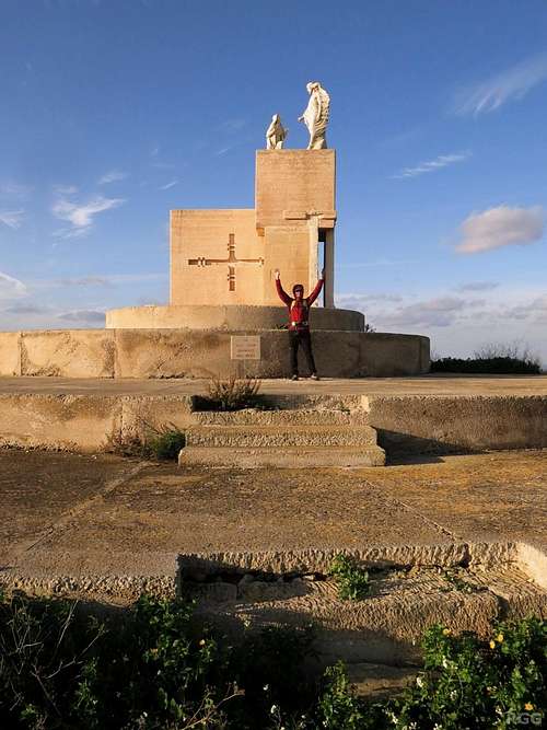 Jan on top of Ta'Għammar, with statue 14 of the <a href=https://en.wikipedia.org/wiki/Stations_of_the_Cross>Way of the Cross</a> up there