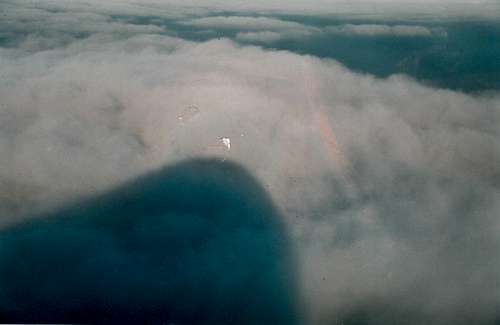 Shadow of Mt Warning on clouds..Au. (sorry about rip in photo from sticking to frame glass)
