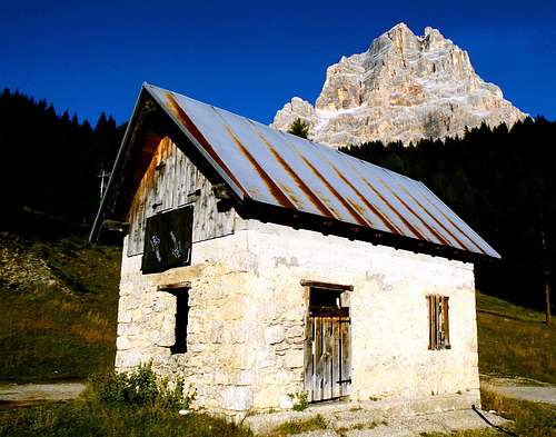 Old thiny shelter and Pelmo seen from the Val di Zoldo road