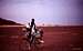 A cyclist in the middle of the Sahel desert