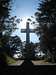 An illuminated cross atop Mt. Davidson