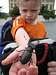 My son holding big beetle