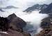Summit view to cloudy Cap de Long lake