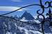 Zooming in on the Matterhorn through the wrought iron of the Pointe de Vouasson summit cross